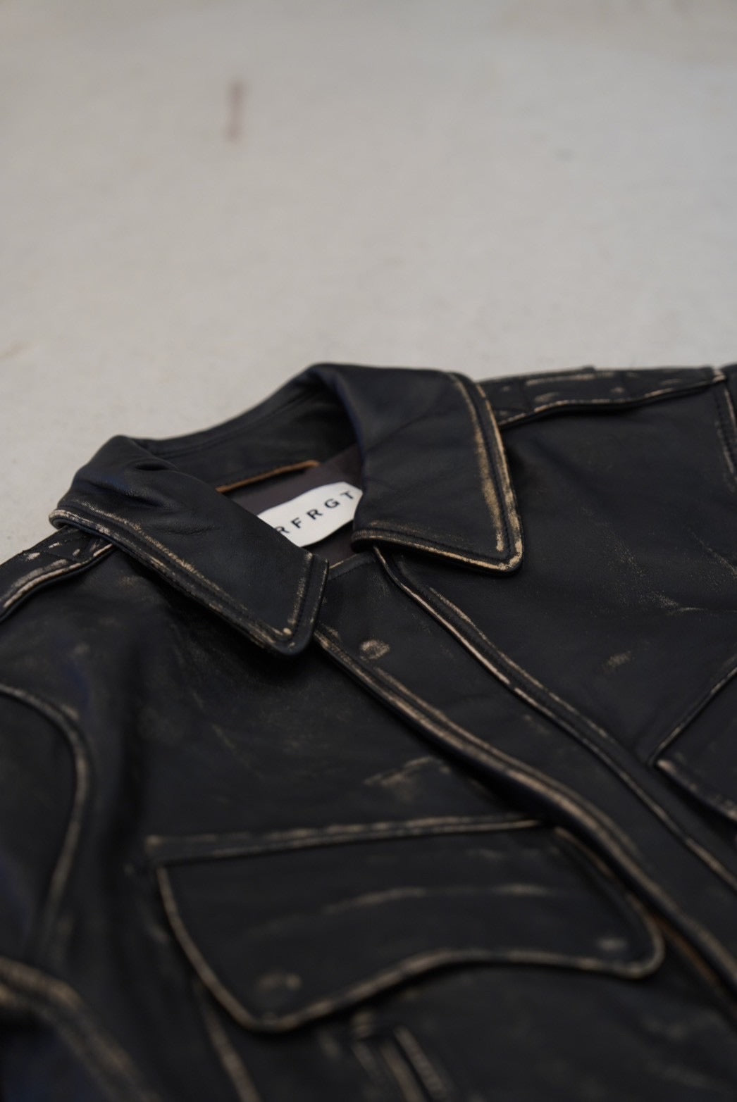 NVRFRGT DISTRESSED LEATHER BOMBER JACKET