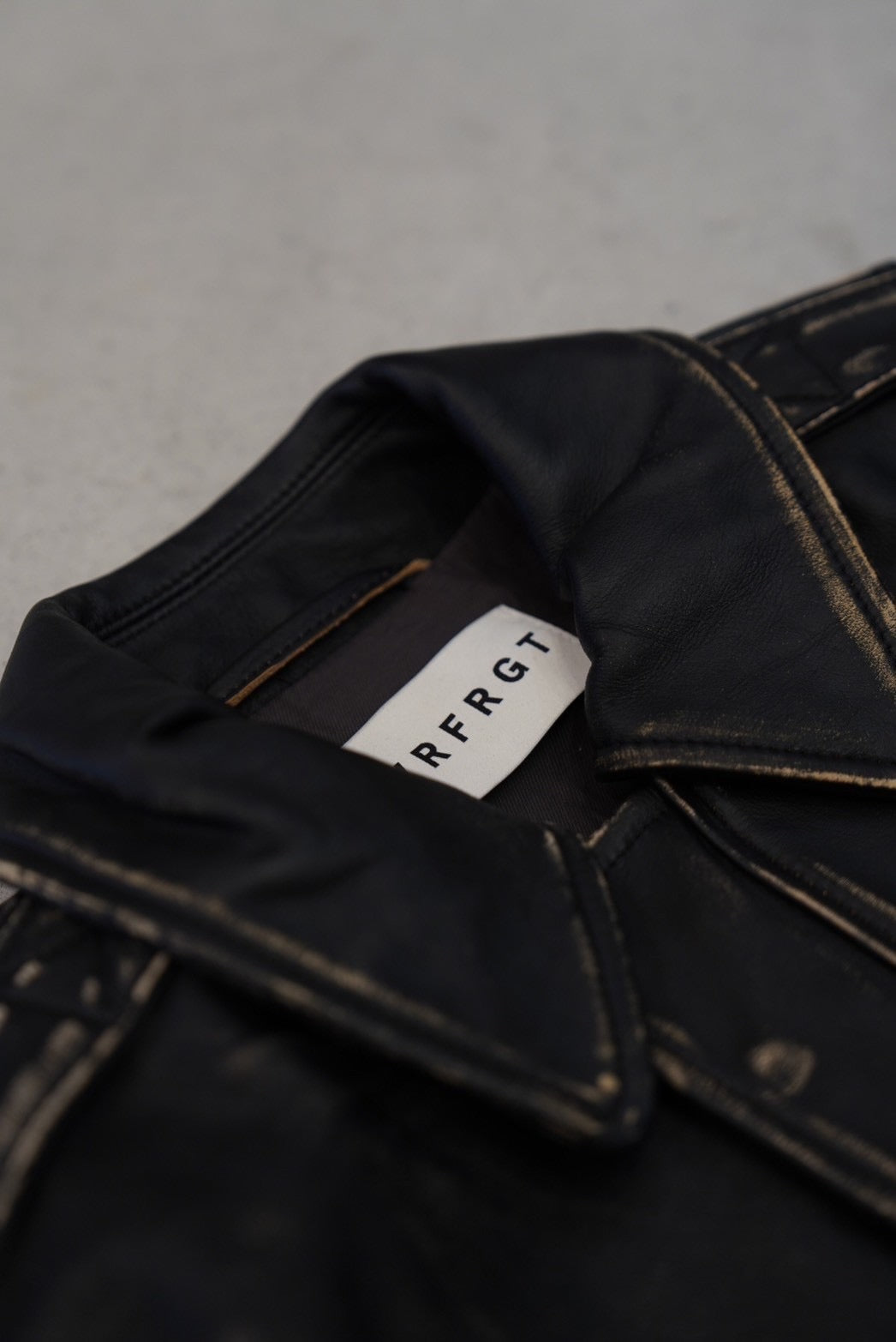 NVRFRGT DISTRESSED LEATHER BOMBER JACKET